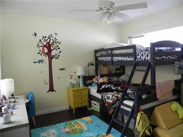 bedroom featuring dark hardwood / wood-style flooring and ceiling fan