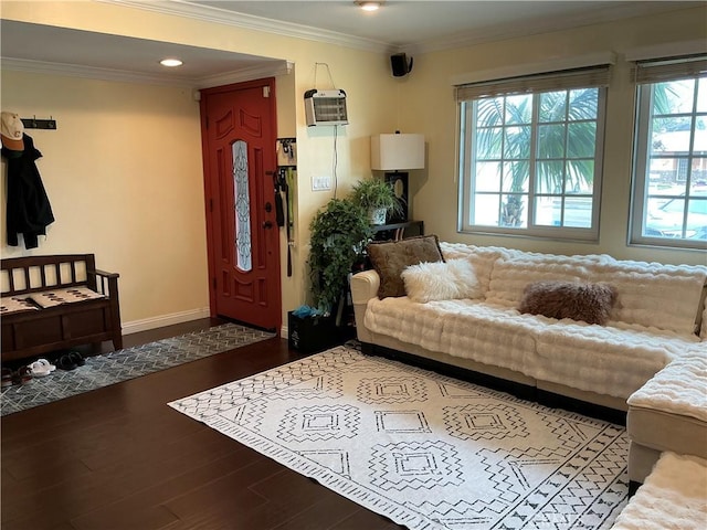 living room featuring hardwood / wood-style flooring, a wall mounted air conditioner, and crown molding