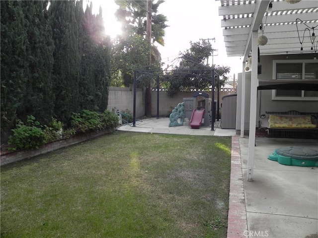 view of yard with a gazebo, a pergola, a patio area, and a playground