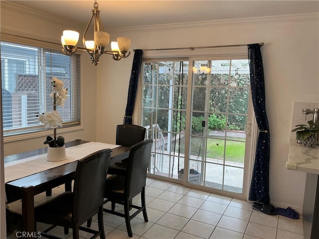 dining area featuring an inviting chandelier, crown molding, and light tile patterned flooring