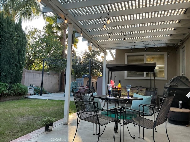 view of patio / terrace featuring grilling area, a storage shed, and a pergola