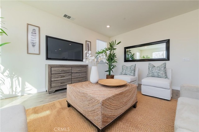 living area with light hardwood / wood-style flooring