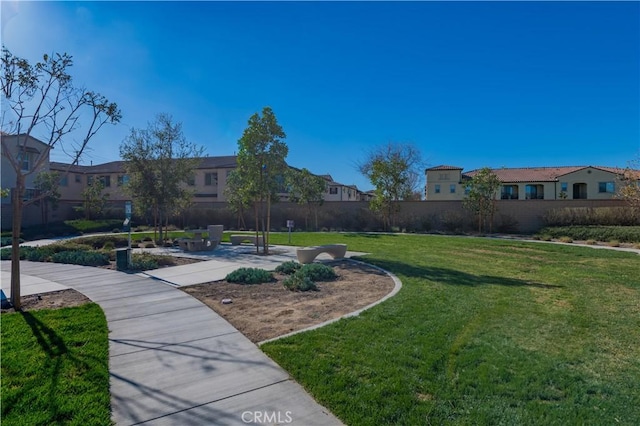 view of home's community featuring a yard