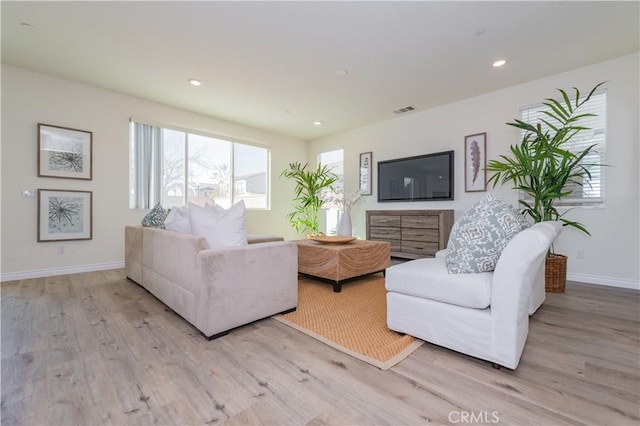 living room with light hardwood / wood-style flooring