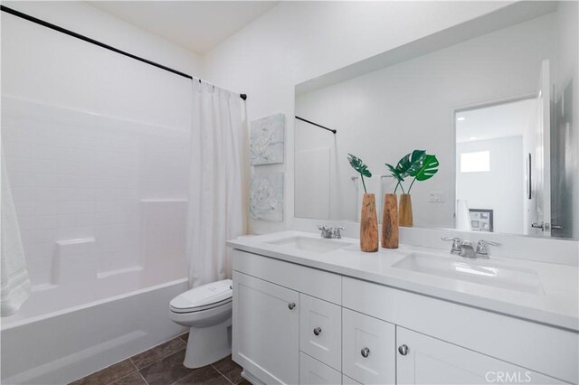 full bathroom with toilet, tile patterned flooring, shower / bathtub combination with curtain, and vanity