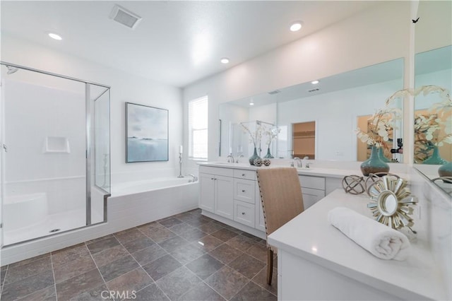 bathroom with plus walk in shower and vanity