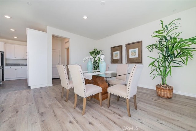 dining room with light hardwood / wood-style floors