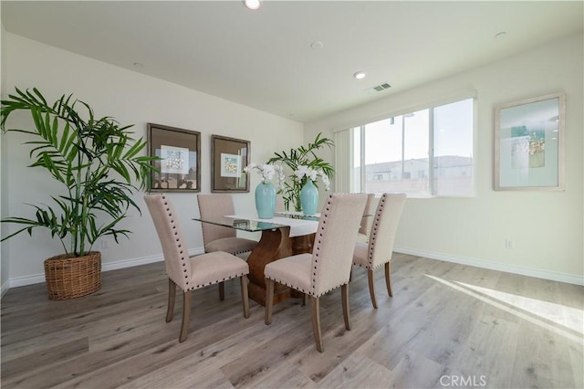 dining room with light hardwood / wood-style flooring