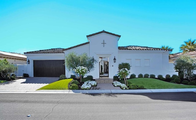 mediterranean / spanish-style home featuring a garage