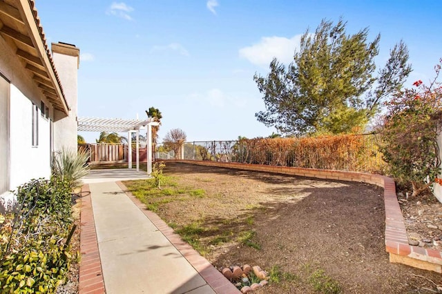 view of yard with a patio area and a pergola