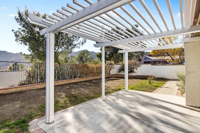 view of patio / terrace featuring a mountain view and a pergola