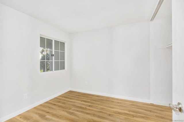 empty room featuring hardwood / wood-style floors