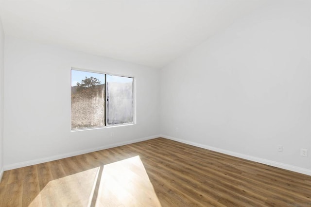 empty room with hardwood / wood-style floors