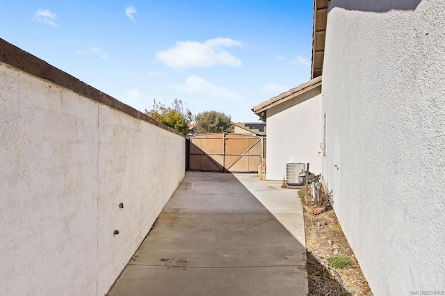 exterior space featuring a patio and cooling unit