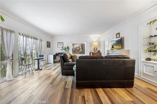 living room featuring hardwood / wood-style floors and crown molding