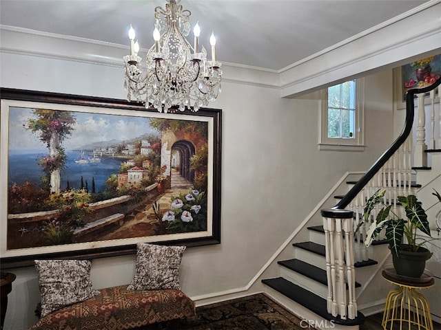 stairway with ornamental molding and a notable chandelier