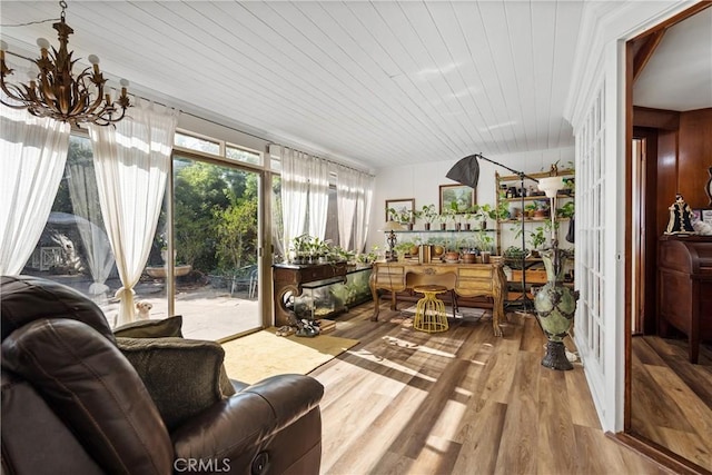 sunroom with wooden ceiling, indoor bar, and a chandelier