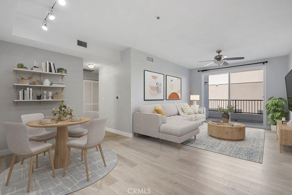 living room with ceiling fan and light hardwood / wood-style flooring