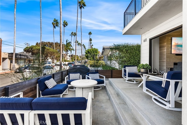 view of patio / terrace featuring an outdoor living space and a balcony