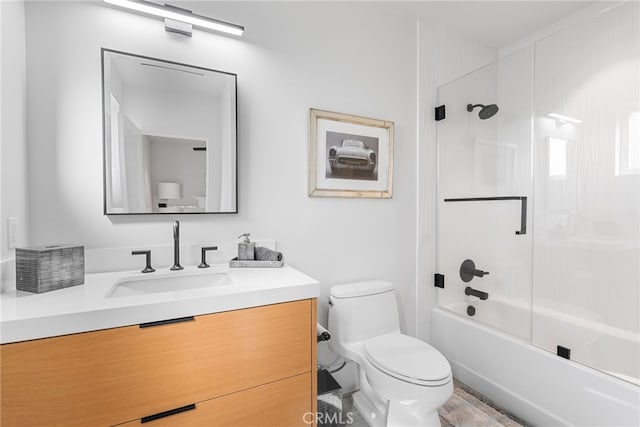 full bathroom featuring toilet, vanity, and bathing tub / shower combination