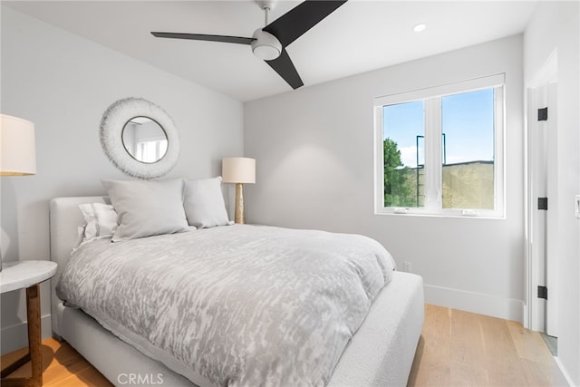 bedroom featuring ceiling fan and light hardwood / wood-style floors