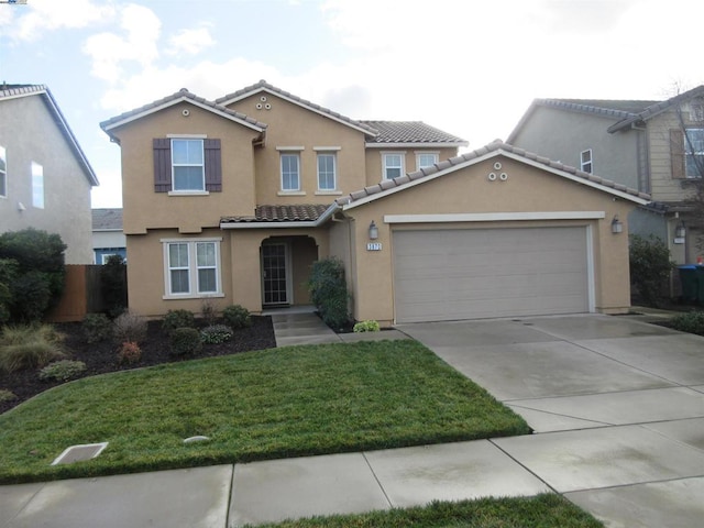 view of front of house featuring a front lawn and a garage