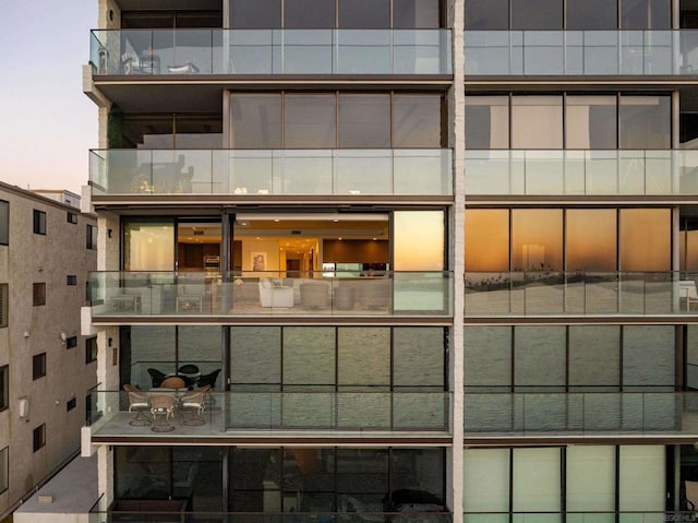 view of outdoor building at dusk