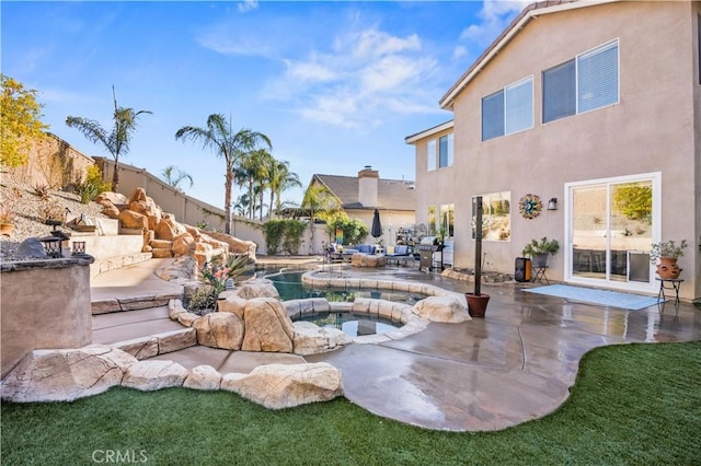 view of pool featuring area for grilling and a patio area