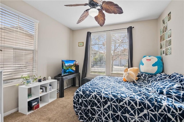 carpeted bedroom featuring ceiling fan