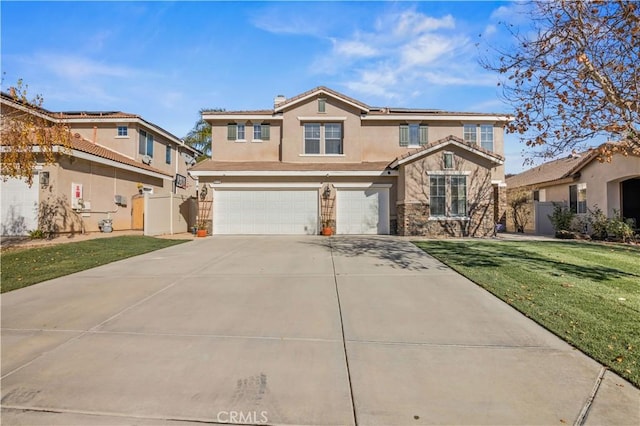 view of property featuring a front lawn and a garage