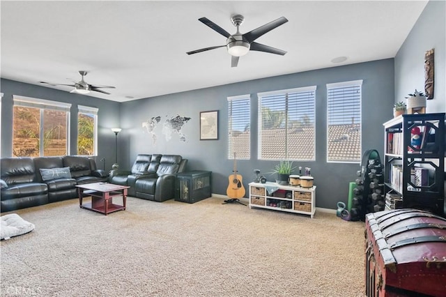 carpeted living room with ceiling fan