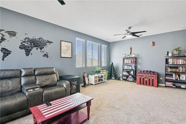 carpeted living room with ceiling fan