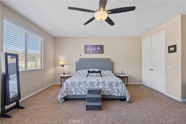 bedroom with carpet flooring, ceiling fan, and a closet