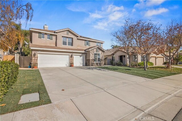 view of front of home with a garage and a front yard