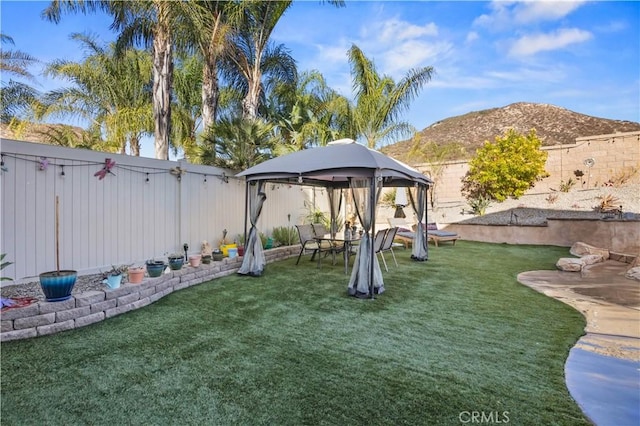 view of yard with a gazebo and a mountain view