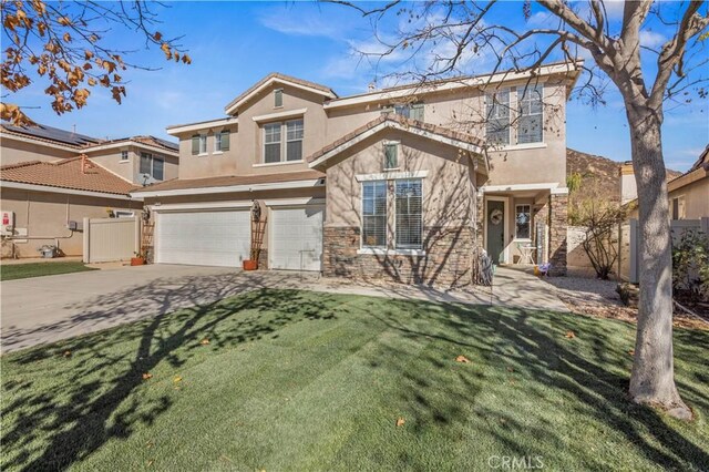 view of front of home featuring a front lawn and a garage