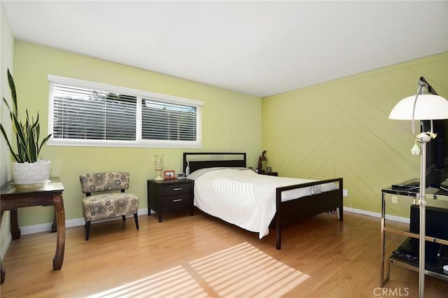 bedroom with wood-type flooring