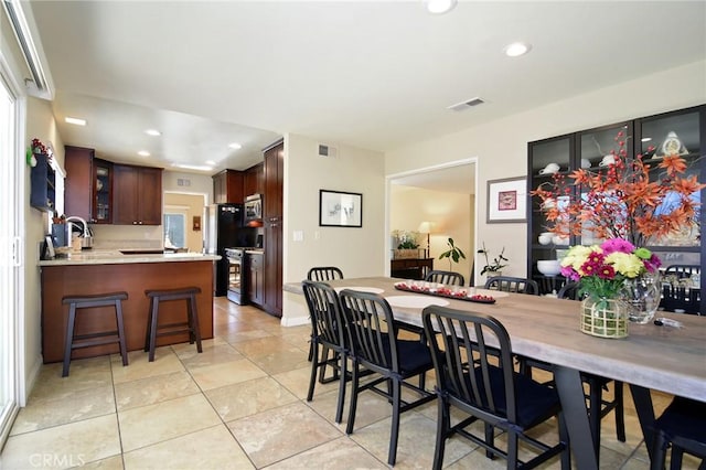 dining room with light tile patterned floors