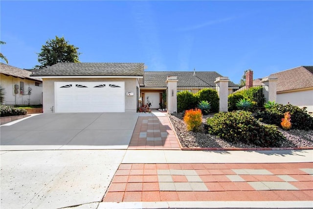 ranch-style house featuring a garage