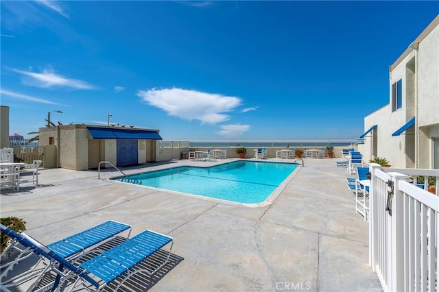 view of swimming pool featuring a patio area