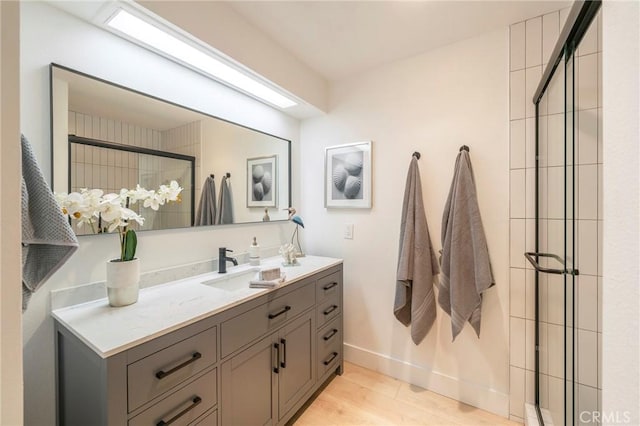 bathroom featuring hardwood / wood-style floors and vanity