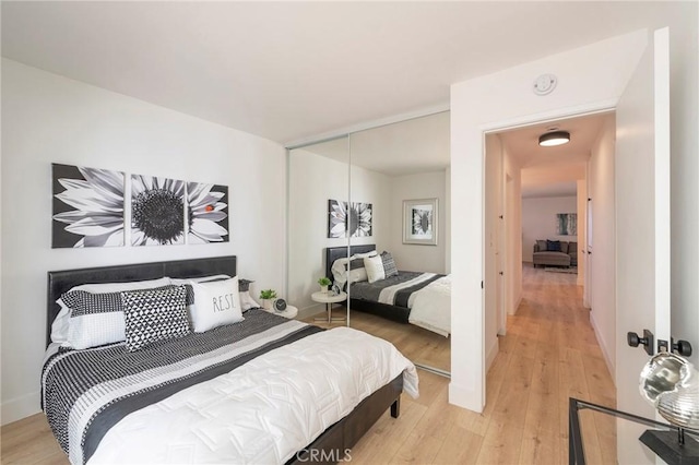 bedroom with light wood-type flooring