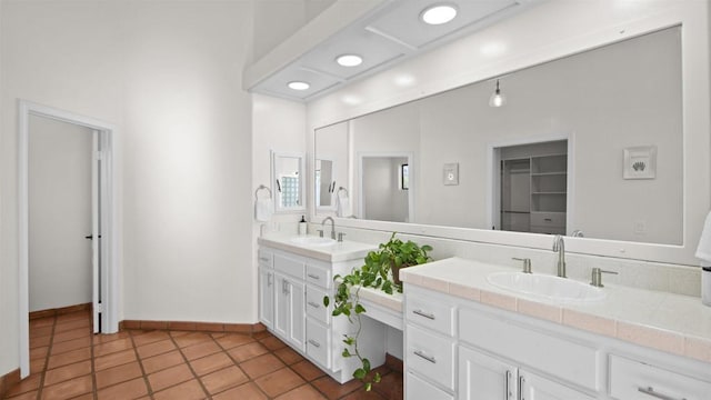 bathroom with tile patterned flooring and vanity