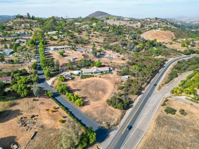 birds eye view of property featuring a mountain view