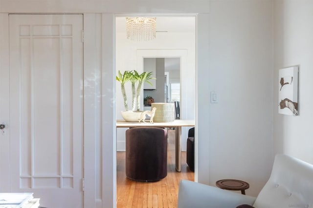 interior space featuring a notable chandelier and light hardwood / wood-style flooring