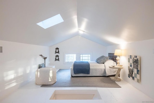 bedroom featuring vaulted ceiling with skylight