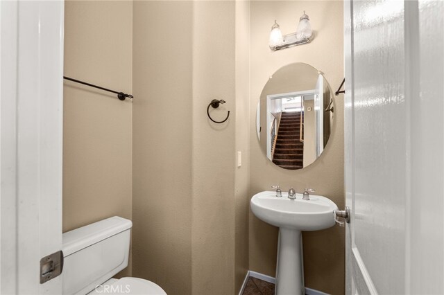 bathroom with sink and toilet