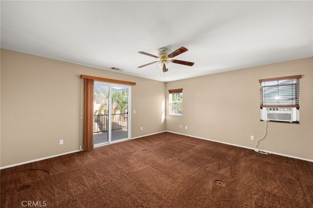 carpeted empty room with cooling unit and ceiling fan