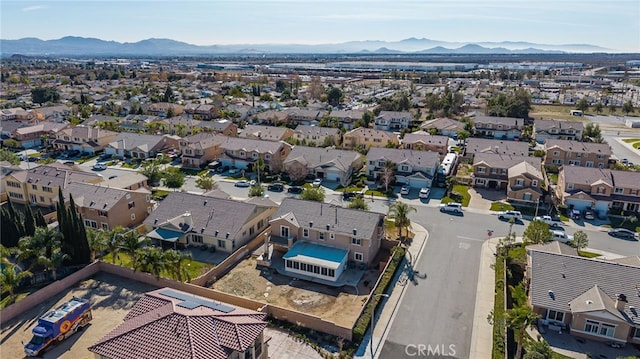 birds eye view of property featuring a mountain view