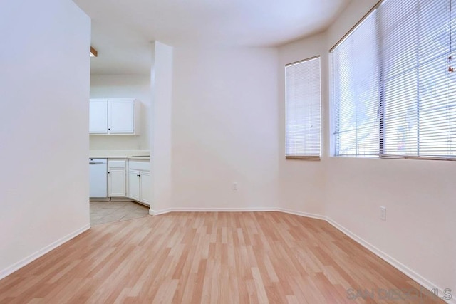 spare room with light hardwood / wood-style floors